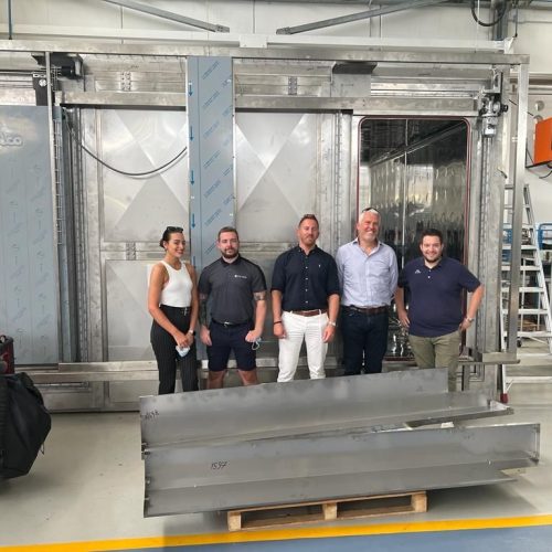 Group shot in front of autoclave at Steelco