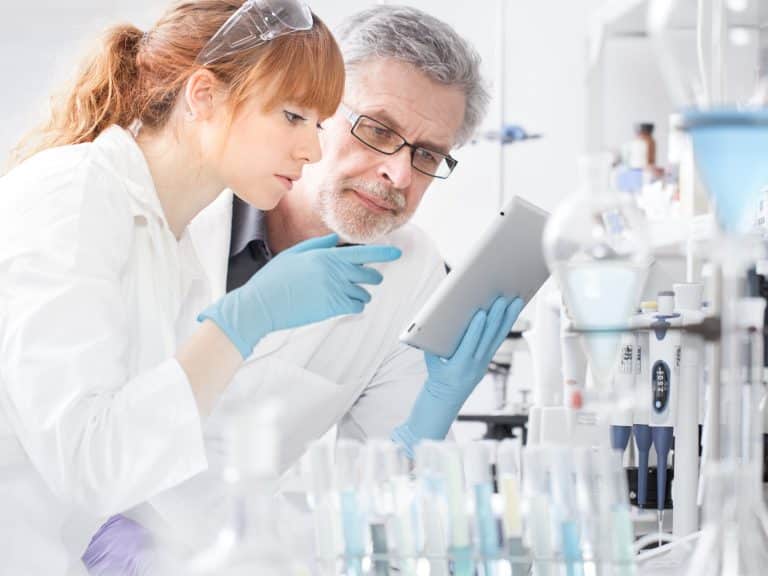 Health care researchers working in scientific laboratory.